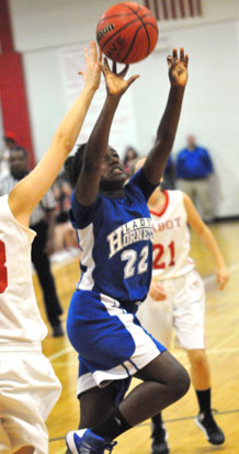 Taylor Hill goes up for a shot under duress. (Photo by Kevin Nagle)