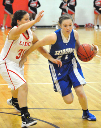 Bryant's Annie Patton tries to drive around a Cabot South defender. (Photo by Kevin Nagle)