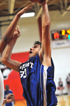 Clay Ingold tries to get a shot over a defender inside. (Photo by Kevin Nagle)