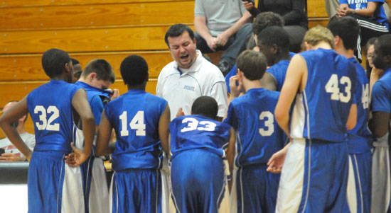 Bryant White coach Heath Long makes a point with his team during a timeout. (Photo by Kevin Nagle)