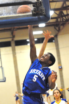 Kris Croom goes high to get a shot away. (photo by Kevin Nagle)