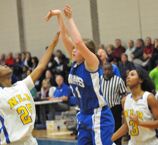 Annie Patton launches a shot between a pair of North Little Rock defenders. (Photo by Kevin Nagle)