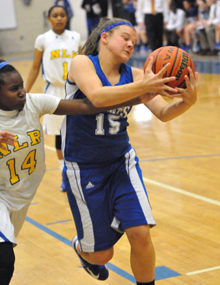Peyton Ramsey (15) battles for a rebound. (Photo by Kevin Nagle)