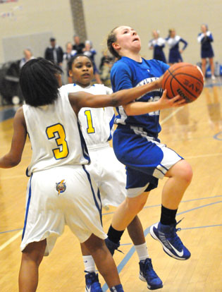 Bryant's Skylar Davis splits the defense on the way to the basket. (Photo by Kevin Nagle)