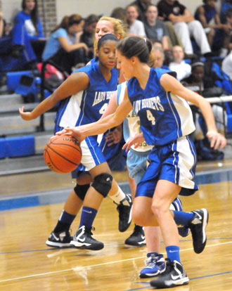 Hadley Dickinson (4) makes a steal. (Photo by Kevin Nagle)