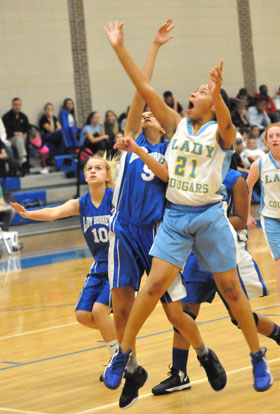 Bryant White's Alyssa Kubaiko (5) defends against a Lakewood shooter. (Photo by Kevin Nagle)