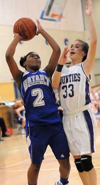 Bryant's Jayla Anderson (2) shoots over Mount St. Mary's Morgan Payne (33). (Photo by Kevin Nagle)