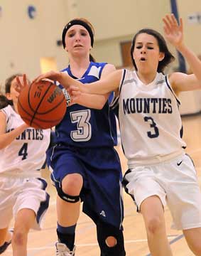 Bryant's Nikki Clay (3, left) gets fouled. (photo by Kevin Nagle)