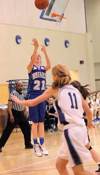 Taylor Lindberg (21) fires up a 3-pointer during Bryant's fourth-quarter comeback. (Photo by Kevin Nagle)