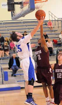 Bryant's Ryan Hall (24) has a shot blocked by Benton's Bryan Kirby (11). (Photo by Kevin Nagle)