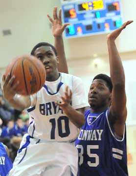 Bryant's Anthony Black (10) scoops up a shot against Xavier Clardy. (Photo by Kevin Nagle)