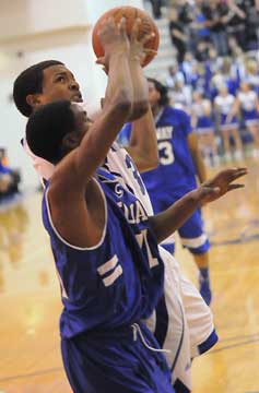 C.J. Rainey gets a shot away under duress. (Photo by Kevin Nagle)