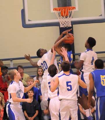 J.C. Newborn blocks a North Little Rock shot. (Photo by Kevin Nagle)