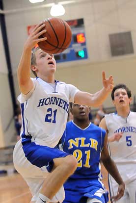 John Winn drives for a layup in front of teammate Brandan Warner and North Little Rock's Robert Verges. (Photo by Kevin Nagle)