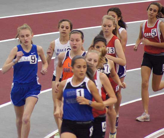 Bryant's Hannah Raney, left, competes in the 3200 meter run at the State Indoor championships Saturday.