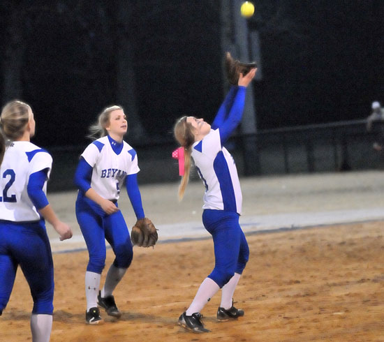 Bryant shortstop Cassidy Wilson flags down a pop as Jenna Bruick (5) backs her up. (Photo by Kevin Nagle)