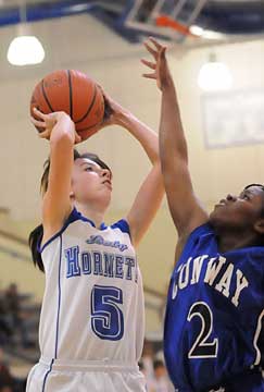 Bryant's Destiny Huffman (5) tries to get her shot away over Conway Blue's Briana Ester. (Photo by Kevin Nagle)