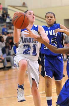 Taylor Lindberg (21) goes up for a shot in front of Conway Blue's Breanna Donohoo. (Photo by Kevin Nagle)