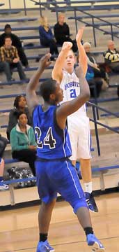 John Winn fires up a 3 in front of Conway Blue's DeRail McCoy. (Photo by Kevin Nagle)