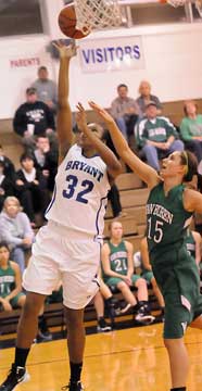 Bryant's Taneasha Rhode (32) arrives for a layup in front of Van Buren's Brittney Campbell. (Photo by Kevin Nagle)