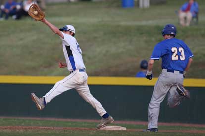 Dylan Cross stretches for a throw at first base. (Photo by Rick Nation)