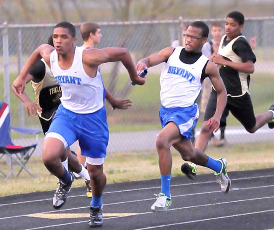 Brendan Young takes the baton from Mar'Kevius Nelson. (Photo by Kevin Nagle)