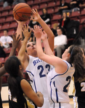 Aubree Allen (23) shoots inside after grabbing an offensive rebound. (Photo by Kevin Nagle)