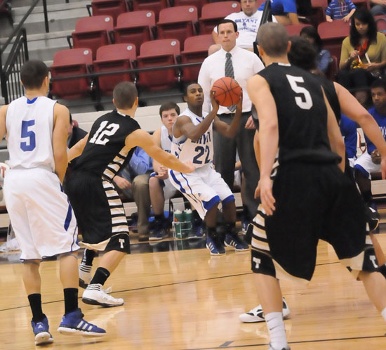 Bryant's Marcus Wilson (22) takes a look at a 3 in front of his head coach Mike Abrahamson as Bentonville's Austin Heard (12) rushes to defend. (Photo by Kevin Nagle)