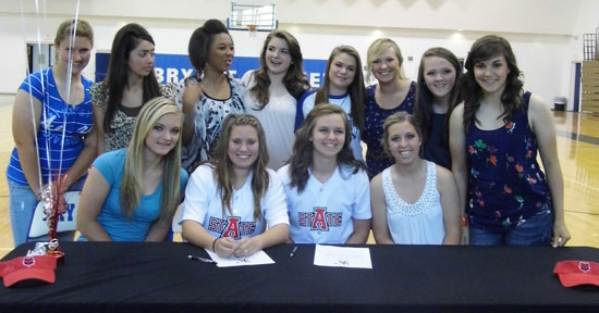 Brittney Ball and Ashley Chaloner are joined by their teammates as they sign with Arkansas State.