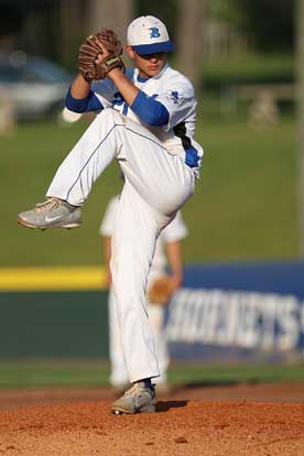 Senior Tyler Nelson kicks in advance of delivering a pitch. (Photo by Rick Nation)
