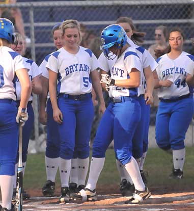 Kayla Sory is greeted by her teammates after her first-inning home run. (Photo by Kevin Nagle)