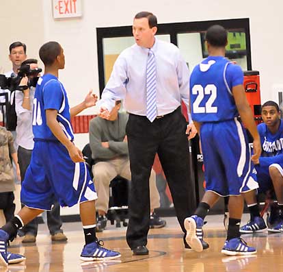 Coach Mike Abrahamson greets Anthony Black as he and Marcus Wilson come off the floor during a timeout. (Photo by Kevin Nagle)