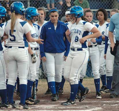 The Lady Hornets greet Jessie Taylor after her three-run homer. (Photo by Val Nagle)