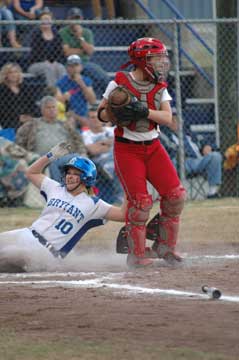 Cassidy Wilson slides safely home. (Photo by Val Nagle)