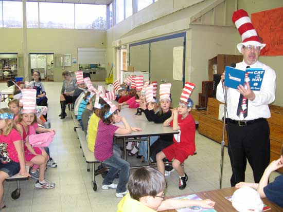 Bryant Elementary School principal Dean Burbank reads to the students. 