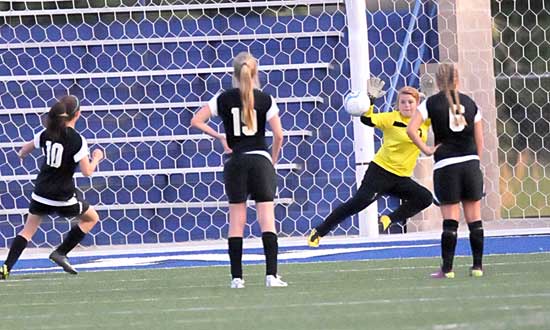 Bryant keeper Kaitlyn Miller dives for a save. (Photo by Kevin Nagle)