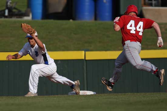 Josh Pultro stretches for a throw to first to retire Cabot's T.C. Carter. (Photo by Rick Nation)