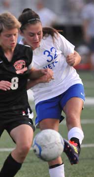 Bryant's Rori Whittaker (32) battles for possession. (Photo by Kevin Nagle)