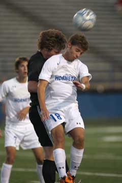 Peter Alverio goes head up with a Central player. (Photo by Rick Nation)