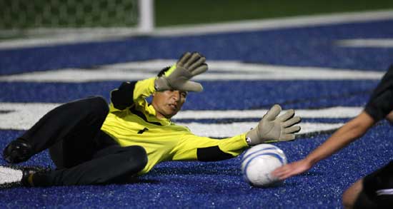 Bryant keeper Victor Rodarte tries make a save. (Photo by Rick Nation)