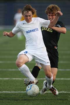 Bryant's Chase Stuart tries to keep a Central player from stealing the ball. (Photo by Rick Nation)