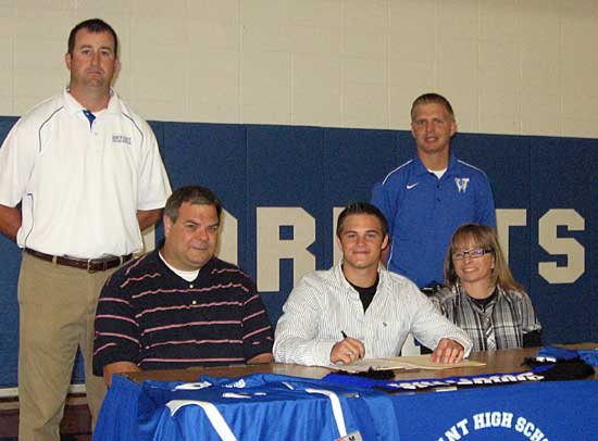 Forrest Fowler is flanked by his parents Paul and Diana Fowler with Bryant head soccer coach Jason Hay, left, and Williams Baptist College head coach Shane Stolz.