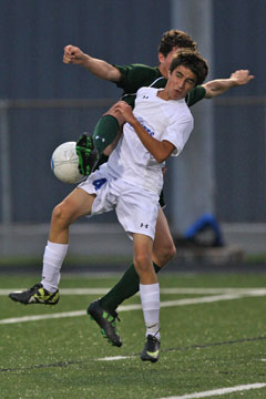 Bryant's Dylan Wolf (4) gets tangled up with a Van Buren player. (Photo by Rick Nation)