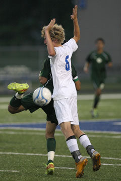 Cameron Furton (6) avoids an illegal touch. (Photo by Rick Nation)