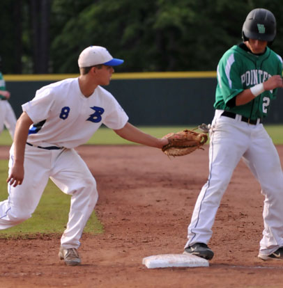 First baseman Josh Pultro (8) holds Van Buren's Cole Plunkett close at first. (Photo by Kevin Nagle)