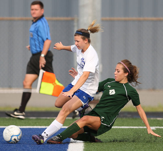 Bryant's Bailey Schlesier (15) avoids a Van Buren steal attempt. (Photo by Rick Nation)