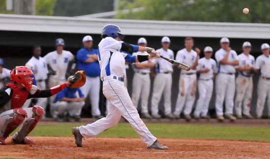 Tyler Nelson ties into a pitch. (Photo by Kevin Nagle)