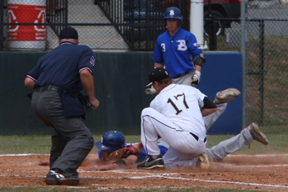 Josh Pultro slides under the tag of Bentonville pitcher Zach McKnight as Tyler Green (3) looks on. (Photo by Rick Nation)