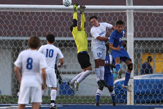 Bryant's Bryce Denker (12) tries to head in a shot in a crowd in front of the Conway goal. (Photo by Rick Nation)