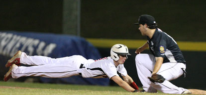 Bryant first baseman Landon Pickett takes a pickoff throw as a Benton baserunner dives back into the bag. (Photo by Rick Nation)